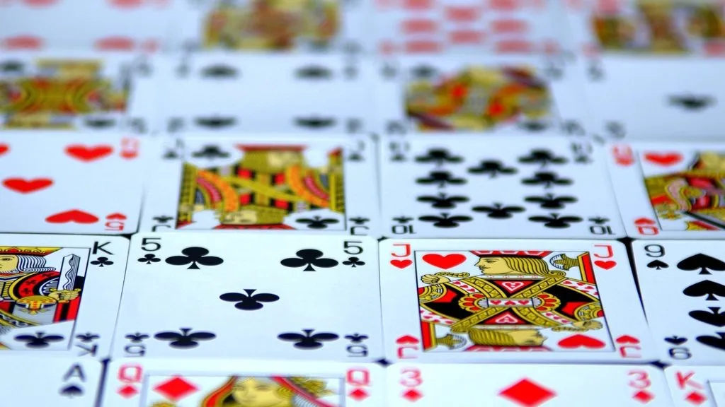 Rows of playing cards laid face up on a table
